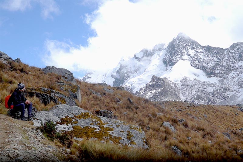 Tourists observing the Salkantay snow-capped mountain