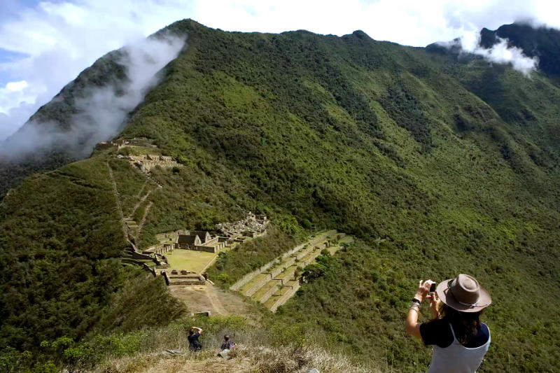 Tourist photographing from the Choquequirao lookout point