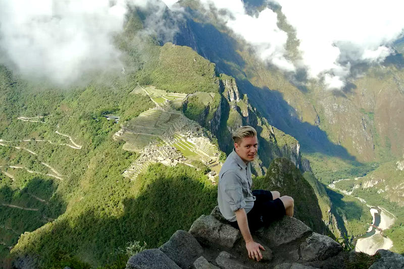 Tourist at the summit of Huayna Picchu Mountain