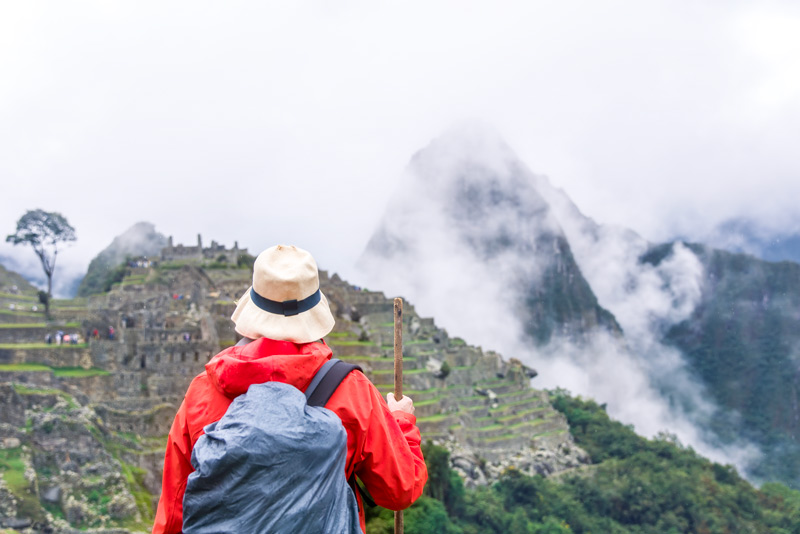 Visitor observing Machu Picchu