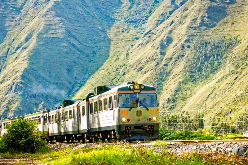 Inca Rail company train heading to Machu Picchu town