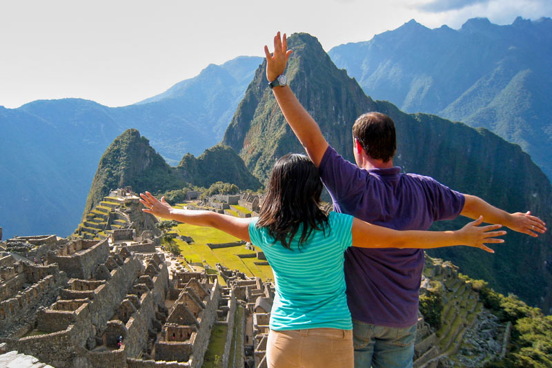 Couple enjoying the amazing view at Machu Picchu