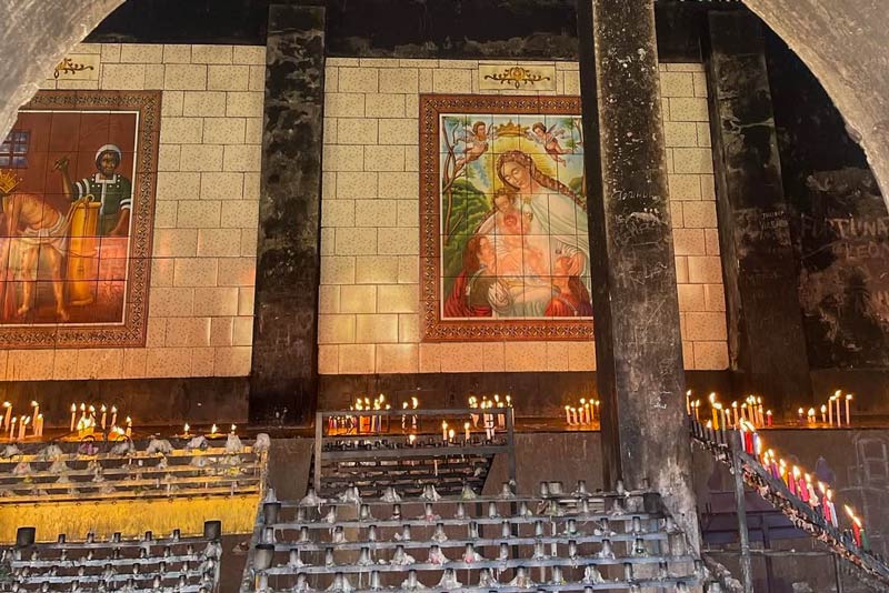 Candles lit at the side of the sanctuary