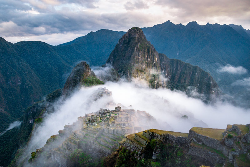 Inca citadel of Machu Picchu covered in mist