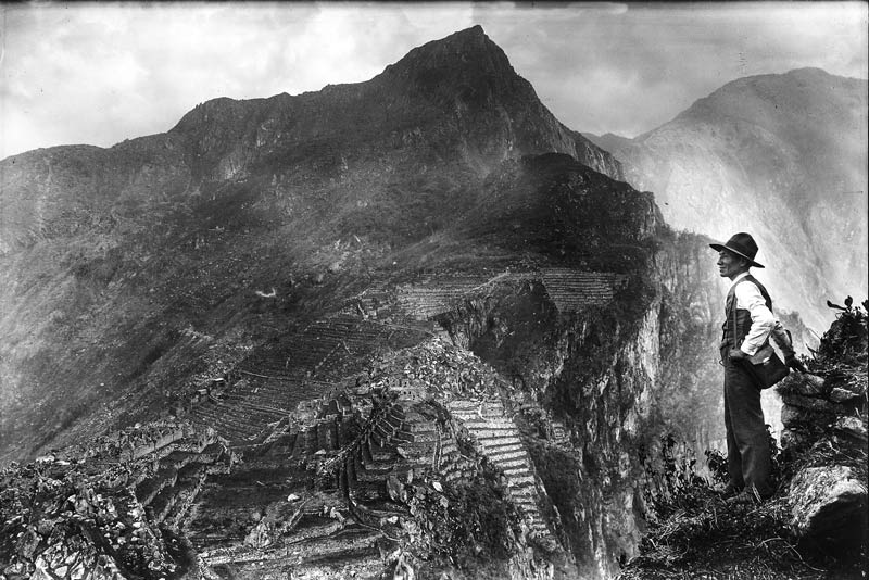 Photograph of a man observing the Inca citadel - year 1911