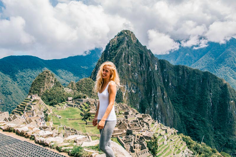 Happy visitor at the wonder of the world – Machu Picchu